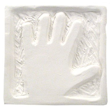 A white clay slab with a hand impression, showcasing texture and detail, ideal for ceramics projects and casting.