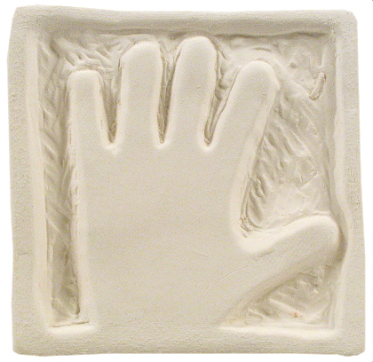 Impression of a hand on a white clay slab, showcasing texture for sculpture or casting projects in pottery.