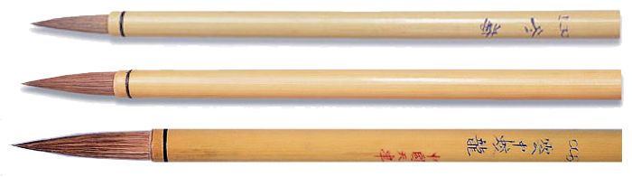 Three bamboo brushes with fine joints, used for decorating ceramics, glazes, and detailing pottery techniques.