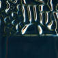 Dark blue ceramic glaze with glossy surface and textured pattern, ideal for enhancing pottery and sculptures.