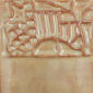 Detail of a carved clay stamp featuring a bridge and rocks, ideal for decorating pottery and ceramic projects.