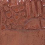 Textured red clay surface displaying natural patterns and variations, ideal for ceramics and pottery projects.