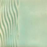 Textured ceramic glaze sample with wavy patterns in mint green, showcasing potential decorating techniques for pottery.
