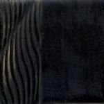 Glossy black ceramic glaze sample featuring subtle wavy texture, ideal for detailing in pottery and sculpture.