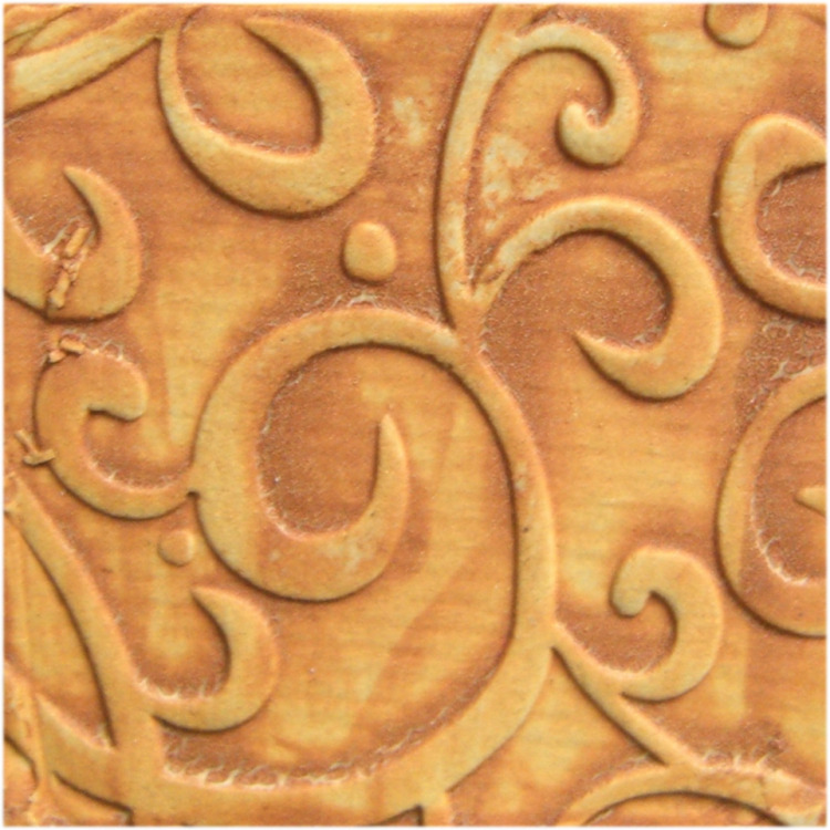 Textured clay tile featuring intricate swirl patterns, perfect for ceramic decoration techniques or sculptural accents.