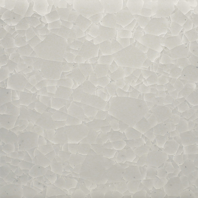 A close-up of a textured white ceramic glaze with a cracked surface effect, ideal for pottery and fine ceramics.