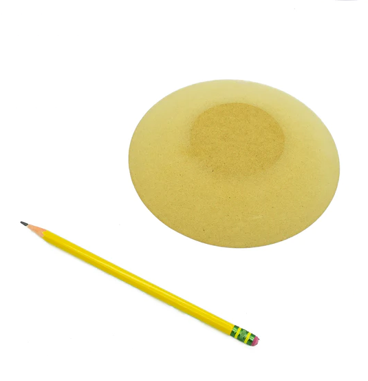 Yellow clay bat with a pencil beside it, used for shaping and trimming pottery at Georgies Ceramic & Clay Company.