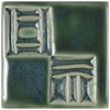 Textured ceramic tiles showcasing a deep green glaze with intricate carved designs, ideal for decorative pottery projects.