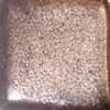 Brown speckled glaze sample with a glossy finish, suitable for ceramic decoration and testing in kiln firing.