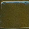 Green and blue textured ceramic glaze sample on a square tile, showcasing variations in color and finish for pottery decoration.