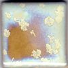 Textured ceramic glaze swatch with soft blue, cream, and brown hues, showcasing floral patterns and intricate details.