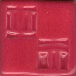 Glossy red ceramic glaze sample tile with textured patterns, ideal for pottery decoration and firing.