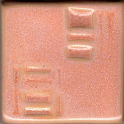 A textured ceramic glaze test tile in soft peach tones, showcasing various raised patterns and a glossy finish.