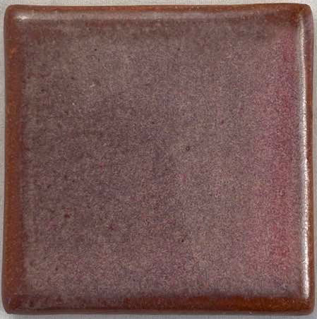 A square ceramic tile showcasing a glossy, brownish-purple glaze with subtle variation in color.