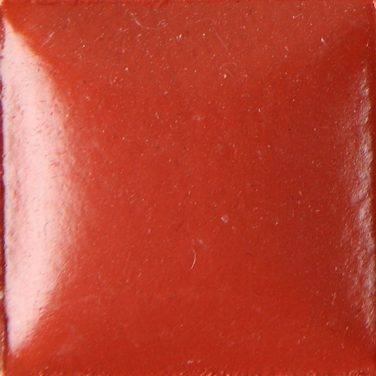 Glossy red ceramic glaze tile with a smooth surface, ideal for pottery and decorative elements in ceramic art.