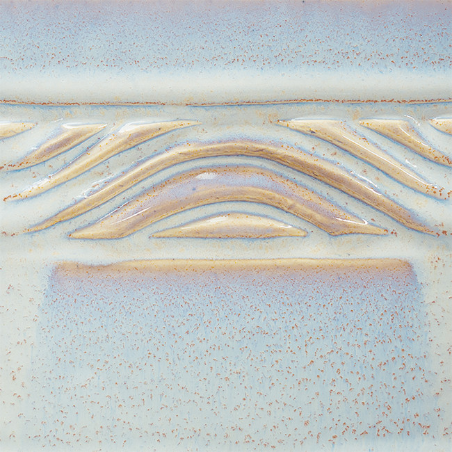 Textured ceramic surface featuring a soft blue glaze with wavy decorative patterns, ideal for pottery and firing projects.