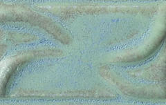 Close-up of a textured ceramic glaze in soft teal with subtle blue undertones, perfect for decorative pottery applications.