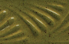 Textured olive-green ceramic surface with subtle ridges, ideal for showcasing glazes and decorative techniques in pottery.