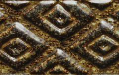 Close-up of a textured ceramic tile with a diamond pattern, featuring a rich brown glaze showcasing depth and variation.