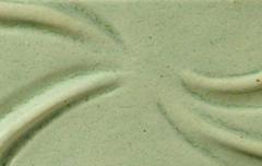 Light green clay surface with subtle ridges, showcasing texture ideal for sculpting and decorative pottery techniques.