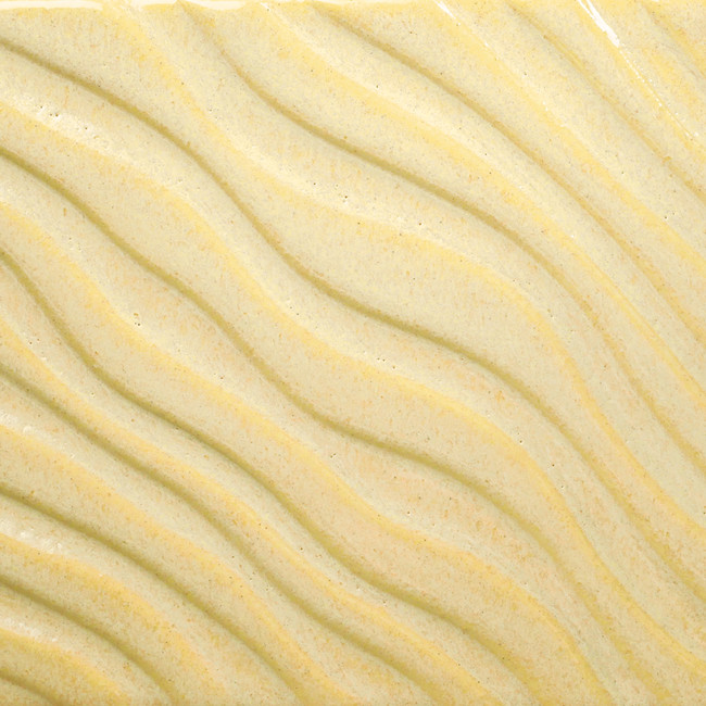 Textured yellow clay surface with wavy patterns, ideal for decorative pottery or ceramic tile applications at Georgies.