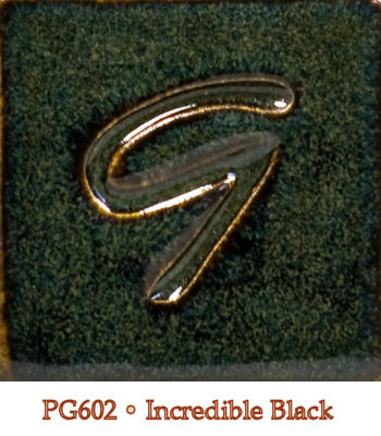 Close-up of PG602 Incredible Black glaze, featuring a glossy green-black surface with a distinctive glossy 'G' design.