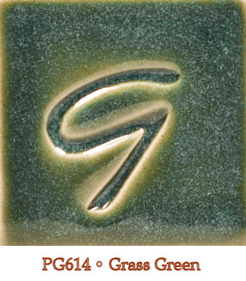 Green ceramic glaze sample labeled PG614 • Grass Green with a glossy surface and a stylized letter G embossed in the center.
