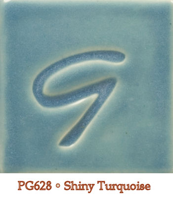 Shiny turquoise glaze tile labeled PG628, featuring a subtle G design impressed into the surface.