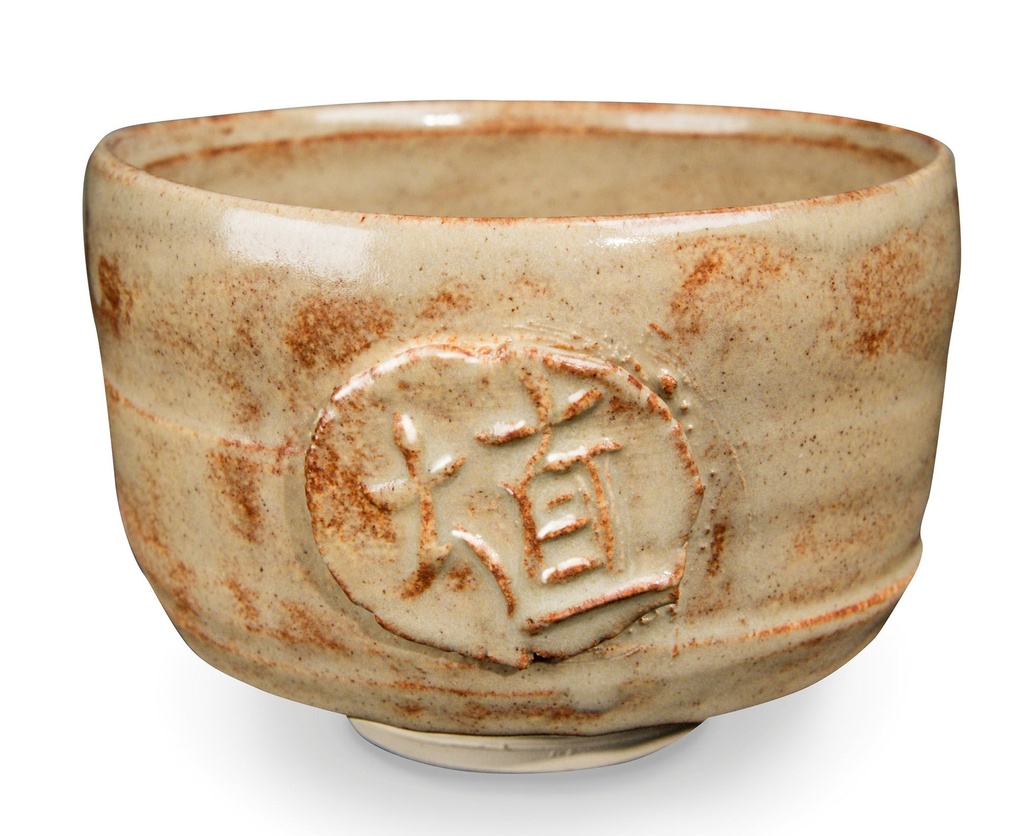 Stoneware pottery bowl with a textured, earthy finish and an embossed decorative symbol, ideal for glaze experimentation.
