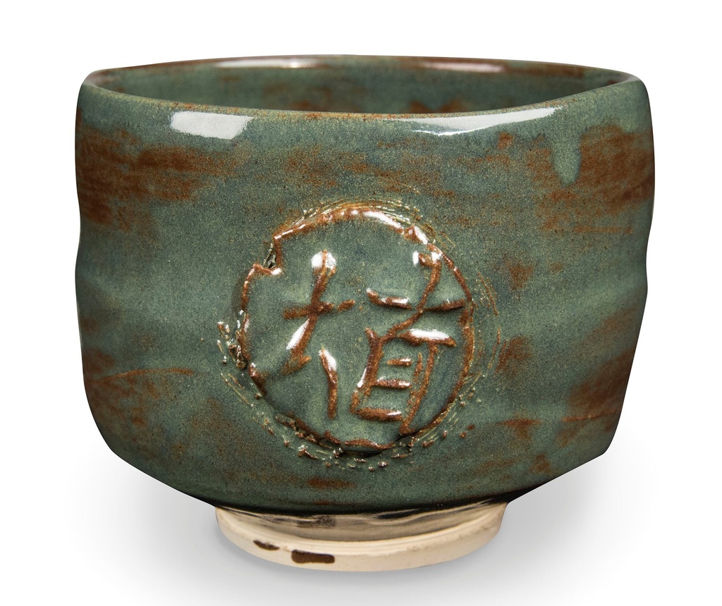 Glazed ceramic cup with a textured surface and embossed design, showcasing a rich green color with brown accents.