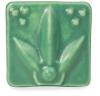 Glossy green ceramic tile featuring a leaf design, perfect for decorative pottery or sculpture projects at Georgies Ceramic & Clay Company.