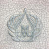 A detailed ceramic tile featuring a blue and white design of two hands cradling a droplet, showcasing intricate glaze details.