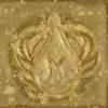 Ceramic tile featuring a detailed embossed design with an ornate motif and glossy yellow glaze finish.