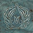 Mottled teal ceramic glaze with an embossed logo featuring a droplet and stylized wings, ideal for pottery decoration.