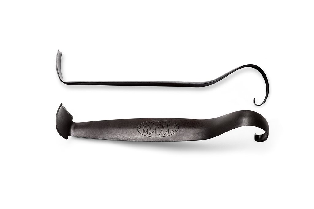 Two ceramic trimming tools: one with a curved end and the other straight, ideal for shaping pottery and clay projects.