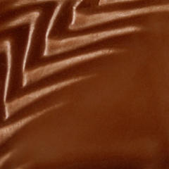 Glossy brown ceramic glaze with textured surface patterns, ideal for adding depth to pottery and sculpture projects.
