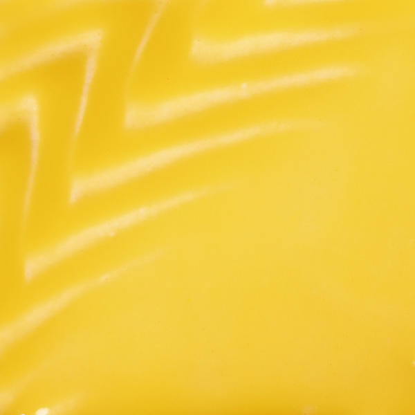 Bright yellow ceramic glaze with glossy texture, ideal for pottery decoration and vibrant color applications.