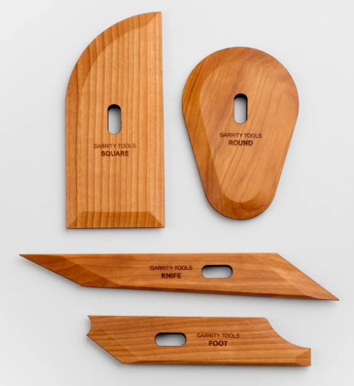 Four Garrity Tools for ceramics: Square, Round, Knife, and Foot wooden sculpting tools, designed for precision in clay work.