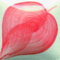 Abstract ceramic piece featuring a pink and white swirl design, showcasing glazing techniques on clay.
