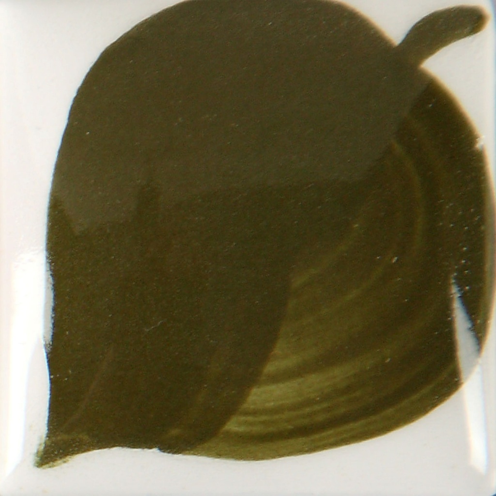 Dark olive green glaze sample on a white ceramic tile, showcasing a smooth application ideal for pottery decoration.