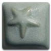 Star-shaped ceramic glaze sample in a soft mint green finish, showcasing texture and color for pottery decorations.