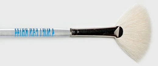 Fan brush with soft white bristles and metallic handle, ideal for applying glazes or decorative finishes in ceramics.
