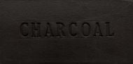 Rectangular clay slab labeled CHARCOAL, showcasing a deep black color, ideal for ceramic projects and glazes.