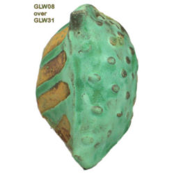 GLW08 + GLW31 Glazed pottery piece showing GLW08 glaze over GLW31, featuring green hues and a textured surface with orange accents.