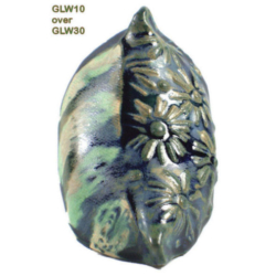 GLW10 + GLW30 Ceramic piece featuring a floral relief design, glazed with GLW10 over GLW30, showcasing shades of green and black.