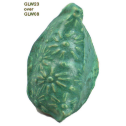 GLW23 + GLW08 Textured ceramic piece glazed in green with floral patterns, identified as GLW23 over GLW08 from Georgies Ceramic & Clay Company.