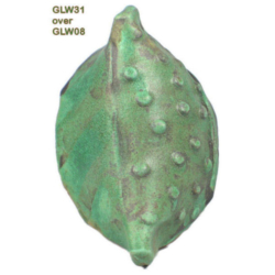 GLW31 + GLW08 Green ceramic leaf-shaped object with textured surface, glazed with GLW31 over GLW08, showcasing vibrant colors and depth.